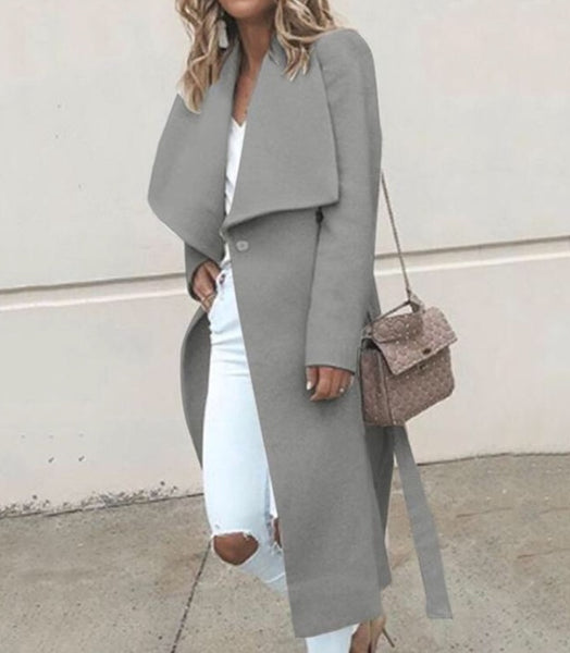 Sobretudo feminino longo de lã com lapela ampla e faixa de amarração, estilo sofisticado ideal para o inverno.
