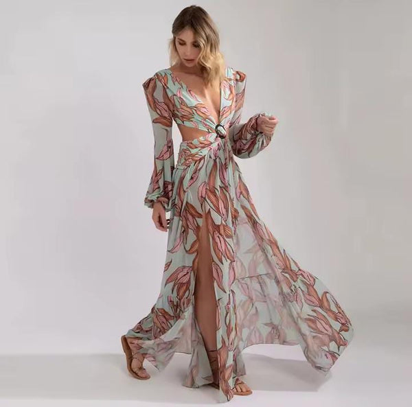 Vestido longo estampado com manga longa, decote V profundo e recorte na cintura, ideal para festas e casamentos