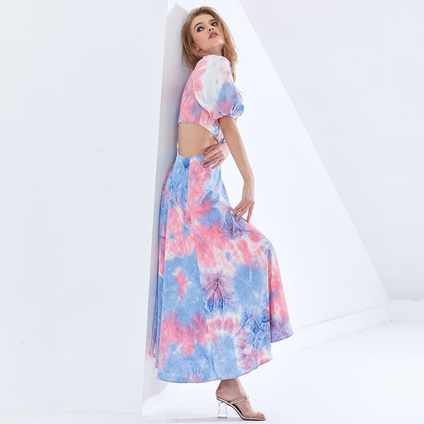 Vestido midi em chiffon com manga curta bufante, recorte na cintura e design em bloco de cor. Look leve, elegante e sofisticado.