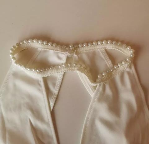 Macacão Branco Pantalona sem Mangas Decote V